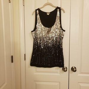Sparkly silver sequins on a black tank.
